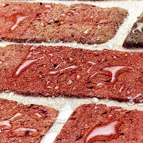 Water beading on bricks after application of sealant
