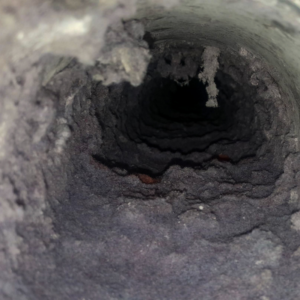 the inside view of a dryer vent filled with lint
