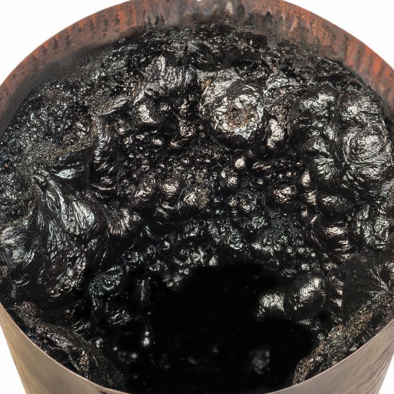 blackened hardened creosote in a reddish vent pipe